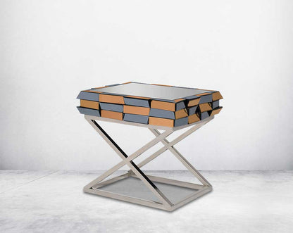End table with clear glass top with grey & tawny mirror & high polished stainless steel legs in a cross design side view