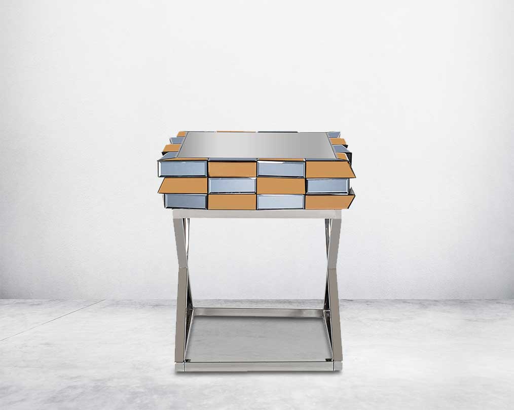 End table with clear glass top with grey & tawny mirror & high polished stainless steel legs in a cross design.
