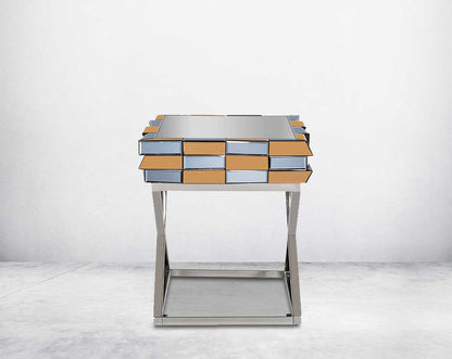End table with clear glass top with grey & tawny mirror & high polished stainless steel legs in a cross design.