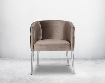 Accent leisure armchair front  upholstered & quilted in luxurious velvet fabric with high polished stainless steel frame and legs.