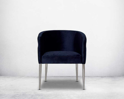 Accent leisure front armchair upholstered & quilted in luxurious velvet fabric with high polished stainless steel frame and legs.