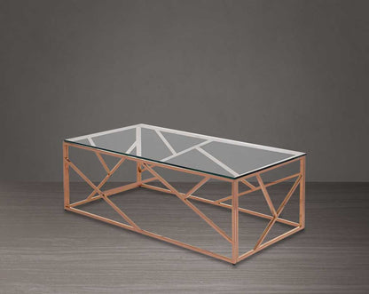 Coffee table with clear glass top and rose gold plated stainless steel frame in sleek contemporary design side view