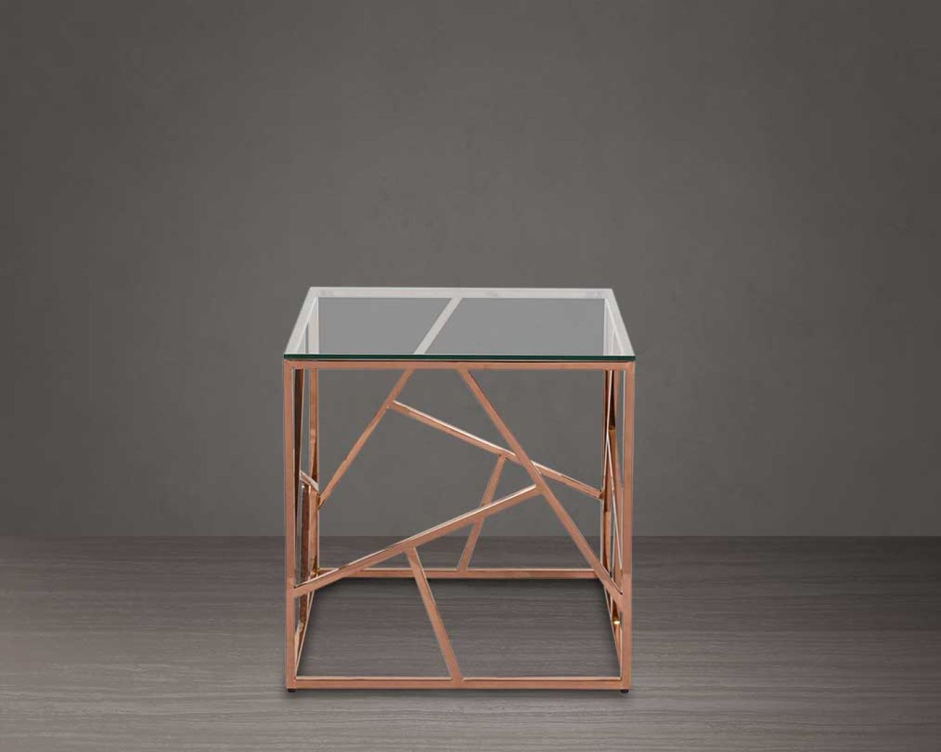 Coffee and end table with clear glass top and rose gold plated stainless steel frame in sleek contemporary design.