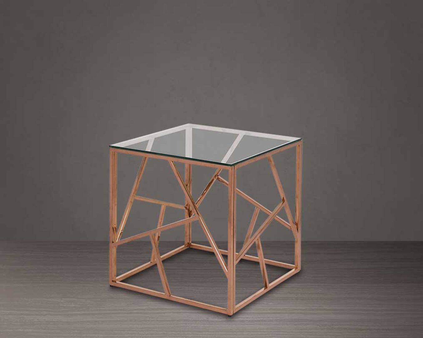 Coffee and end table with clear glass top and rose gold plated stainless steel frame in sleek contemporary design.