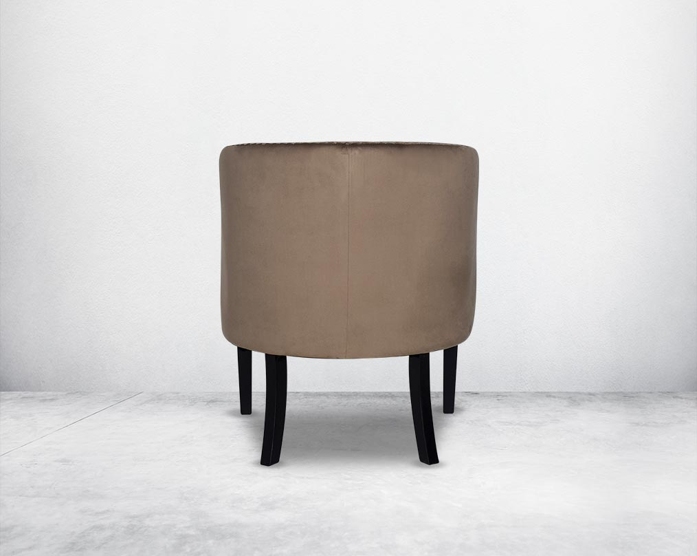 Wing arm chair upholstered in velvet fabric back with  and tufted with steel rivets and legs in brown oak.