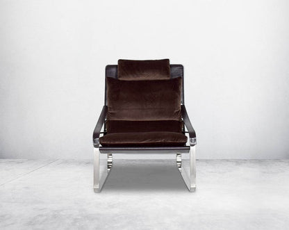 Leisure chair  front upholstered in fabric with high polished stainless steel frame.