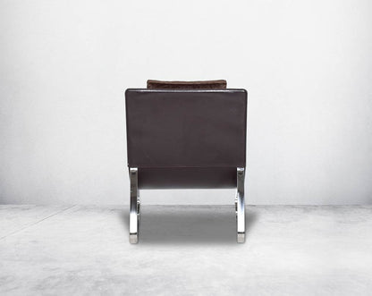 Leisure chair back with  upholstered in fabric with high polished stainless steel frame.