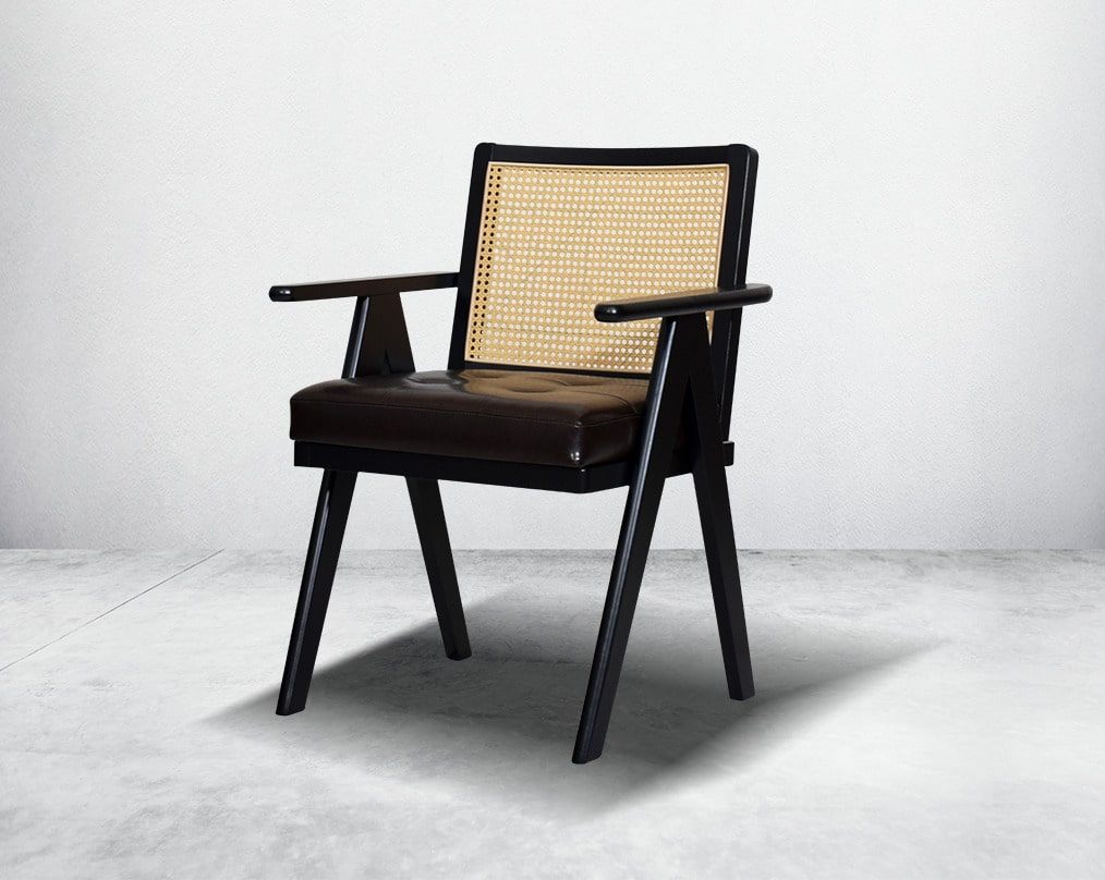 This appealing solid wooden dining chair with comfy cushioned seat & rattan backrest with curved armrest & geometrical leg design in dark walnut finish in retro style.