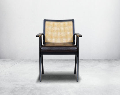 This appealing solid wooden dining chair with comfy cushioned seat & rattan backrest with curved armrest & geometrical leg design in dark walnut finish in retro style.