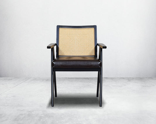 This appealing solid wooden dining chair with comfy cushioned seat & rattan backrest with curved armrest & geometrical leg design in dark walnut finish in retro style.