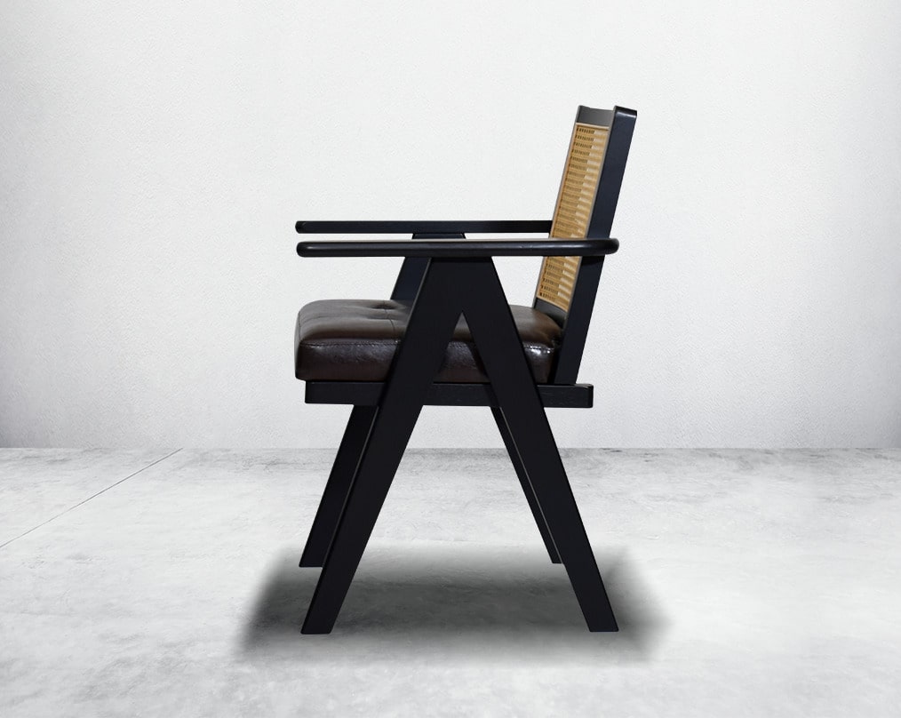 This appealing solid wooden dining chair with comfy cushioned seat & rattan backrest with curved armrest & geometrical leg design in dark walnut finish in retro style.