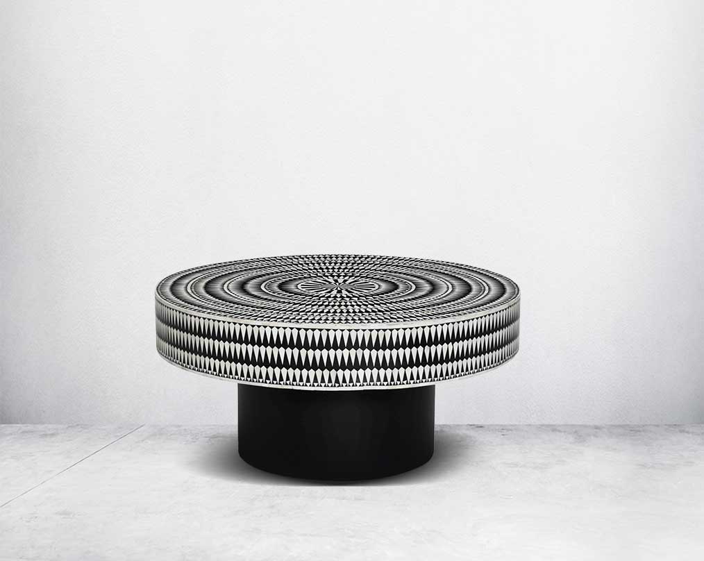 This gorgeous black and white inlay coffee table with a black metal base is a perfect statement piece in your living room.