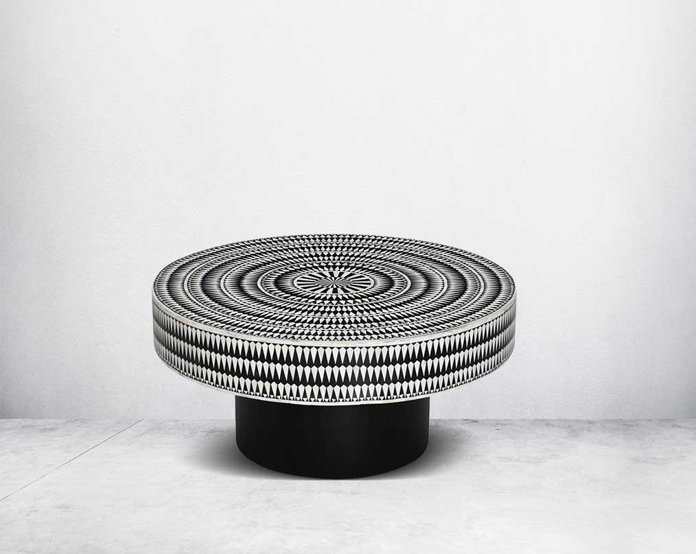 This gorgeous black and white inlay coffee table with a black metal base is a perfect statement piece in your living room.