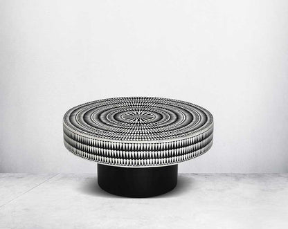 This gorgeous black and white inlay coffee table with a black metal base is a perfect statement piece in your living room.