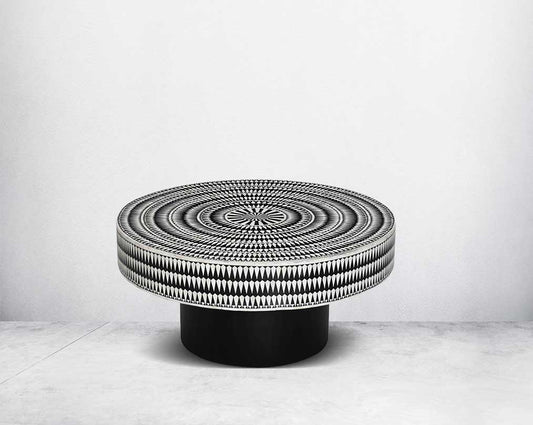 This gorgeous black and white inlay coffee table with a black metal base is a perfect statement piece in your living room.