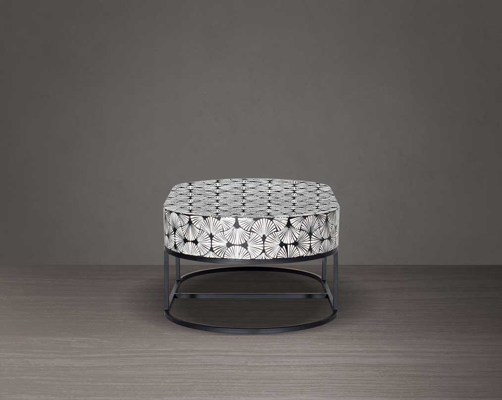 This gorgeous black and white inlay coffee table in floral pattern with a black metal base is a perfect statement piece in your living room. It is a masterwork in inlay in an elaborate pattern.