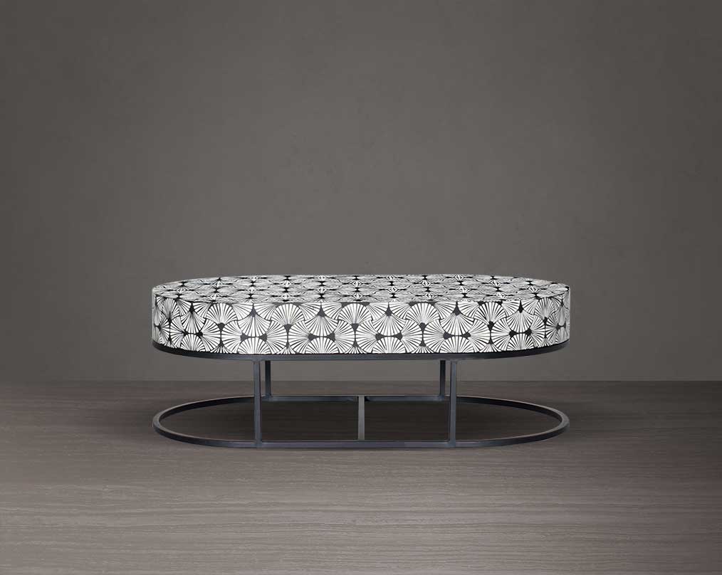 This gorgeous black and white inlay coffee table in floral pattern with a black metal base is a perfect statement piece in your living room. It is a masterwork in inlay in an elaborate pattern.