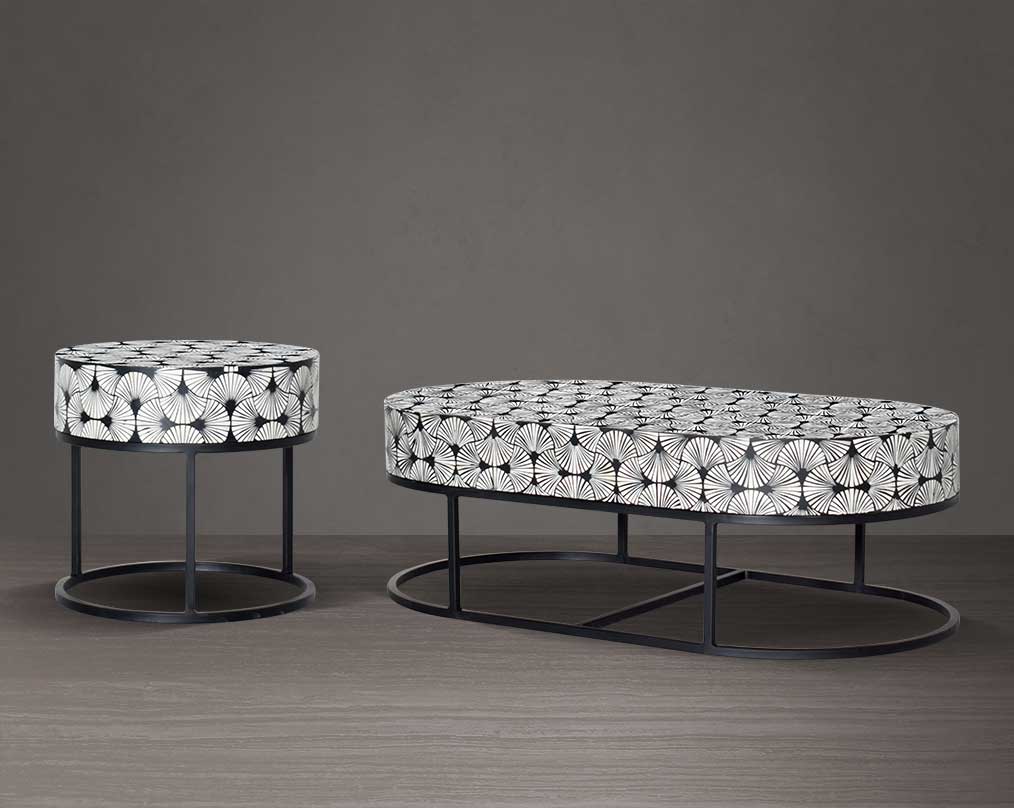 This gorgeous black and white inlay coffee table and end table in floral pattern with a black metal base is a perfect statement piece in your living room. It is a masterwork in inlay in an elaborate pattern.