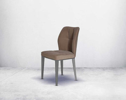 Dining chair upholstered in velvet fabric with high polished stainless steel legs.