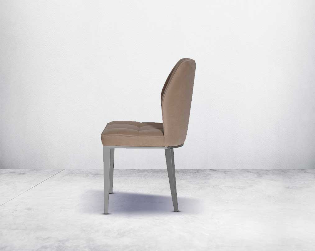 Dining chair upholstered in velvet fabric with high polished stainless steel legs.