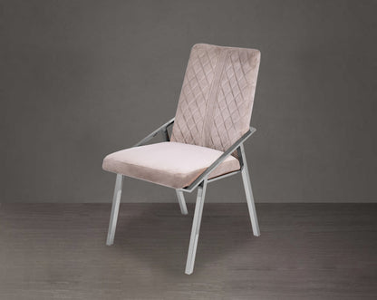 Dining chair upholstered in fabric with stainless steel legs.