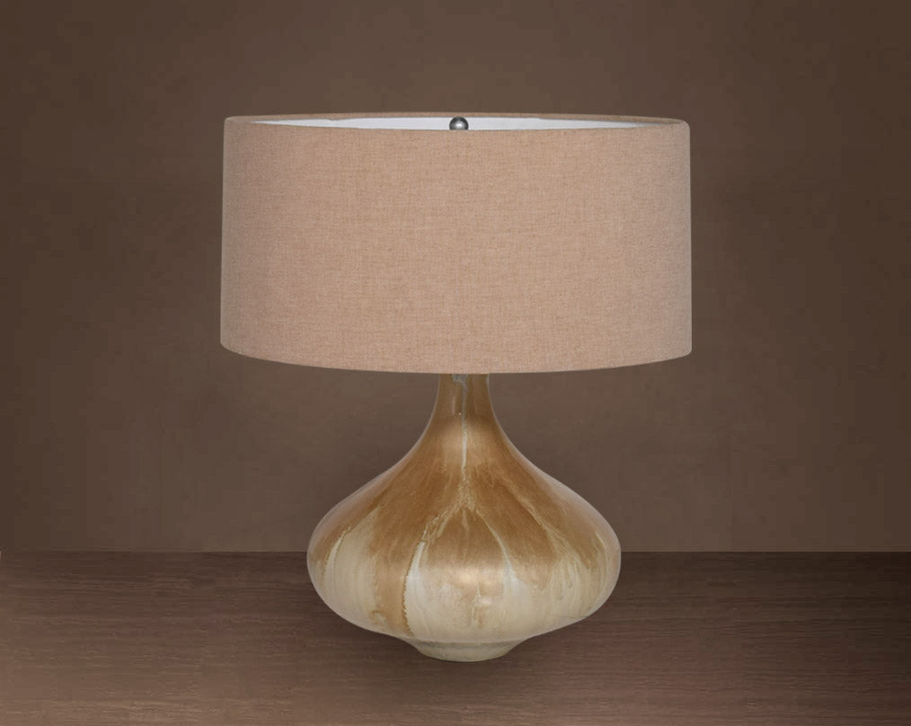 Glass table lamp in Enamel feel with a teardrop-shaped base and translucent beige fabric shade.