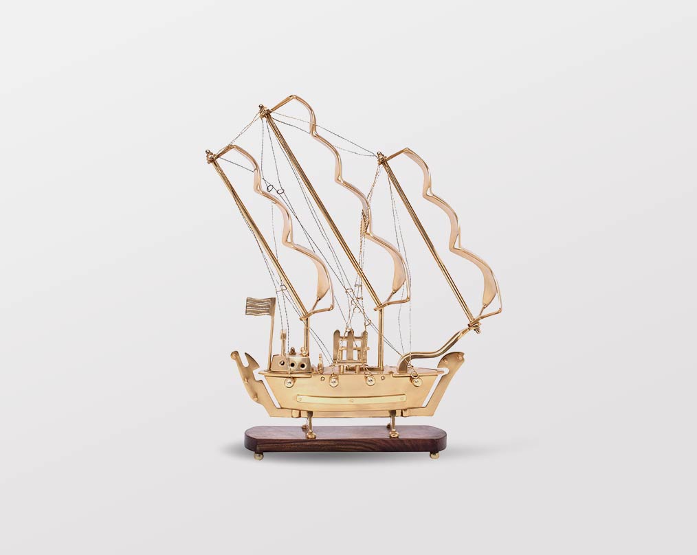 Decorative ship in antique gold and sheesham wood base. small