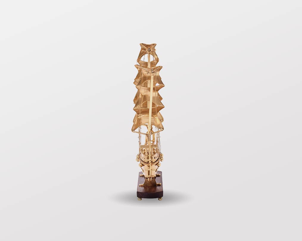 Decorative ship in antique gold and sheesham wood base. straight