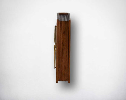 Table clock in antique matt brass and natural wood finish.