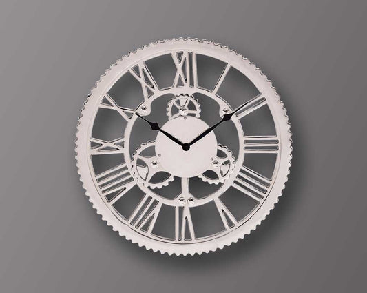 Round wall clock in nickel with roman numerals.