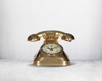 This unique vintage telephone table clock comes with a clock in the centre. This antique clock is made out of brass in an antique matt finish