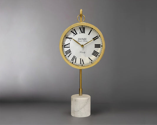 Round clock suspended on a hook in glossy gold & white marble base with front view 