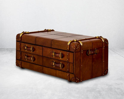 Coffee table in distressed cognac leather in a vintage look with 6 drawers with leather handles, in trunk design.