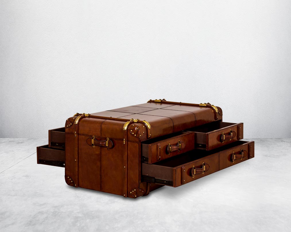 Coffee table in distressed cognac leather in a vintage look with open  6 drawers with leather handles, in trunk design.