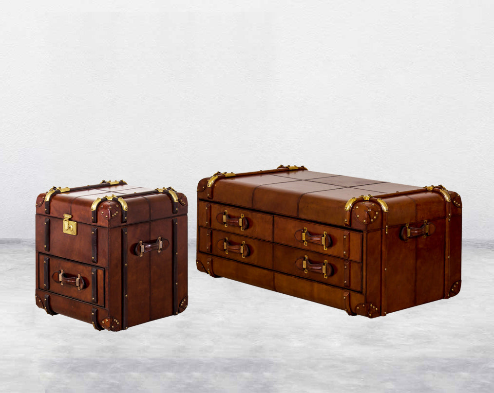 two Coffee table in distressed cognac leather in a vintage look with brass hardware and wooden slats side view