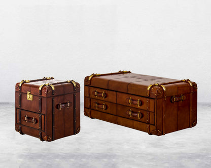 two Coffee table in distressed cognac leather in a vintage look with brass hardware and wooden slats side view