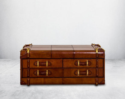 Coffee table in distressed cognac leather in a vintage 4 drawer look It comes with storage and 1 drawer in trunk design front view