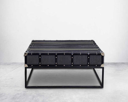 This coffee table inspired by the vintage trunk design motif makes a true focal point in any in modern, contemporary or eclectic decor back view 