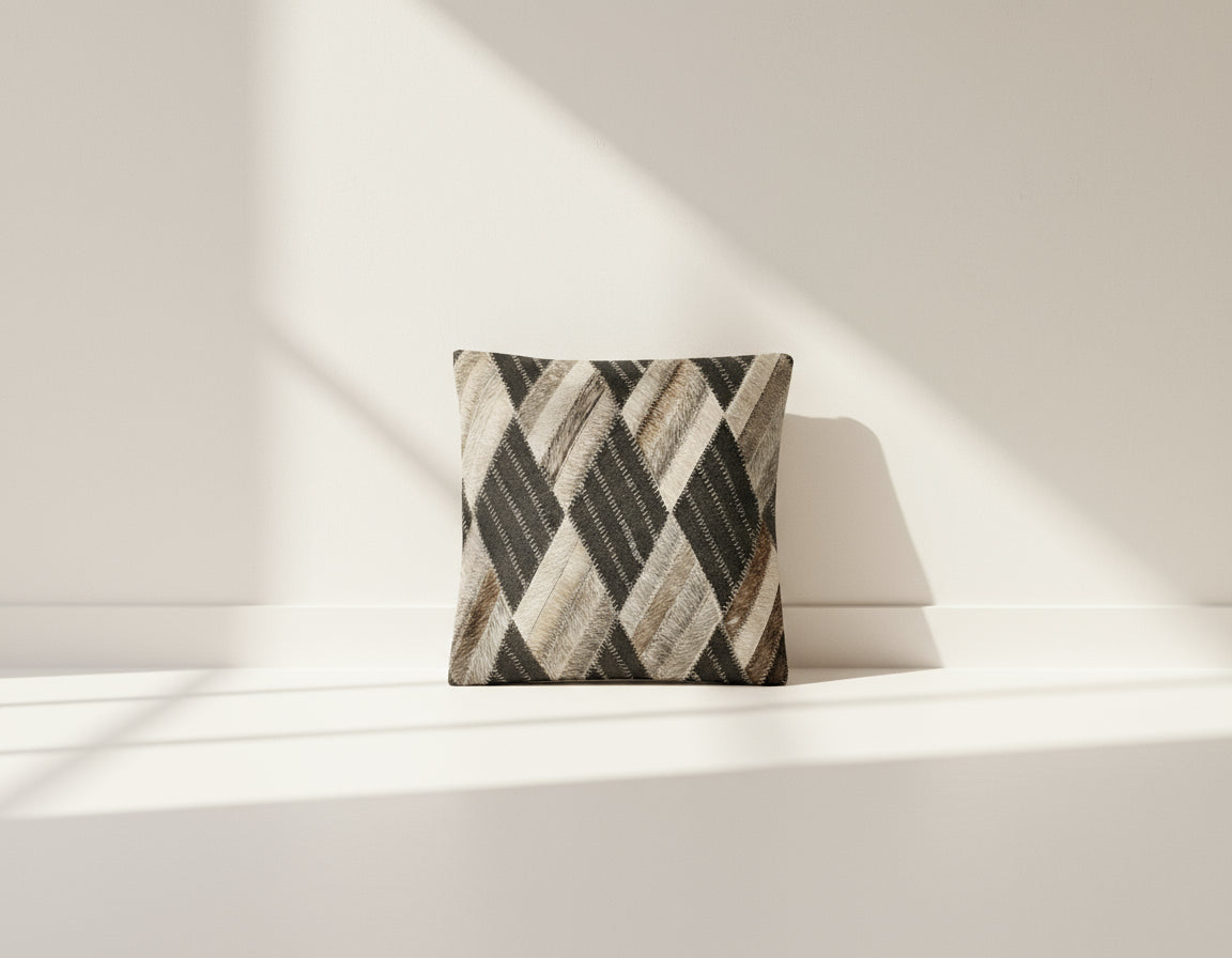 Black and grey hair on the leather cushion.