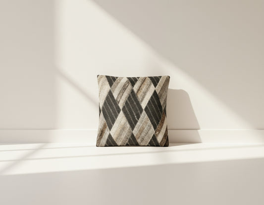 Black and grey hair on the leather cushion.