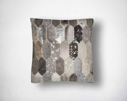 Grey and silver hair on the leather cushion.