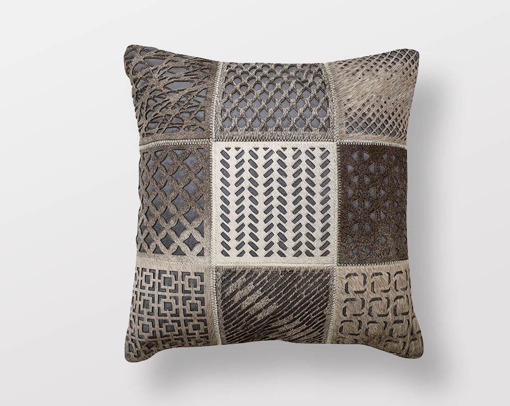 Grey cut-out hair on & a leather cushion.