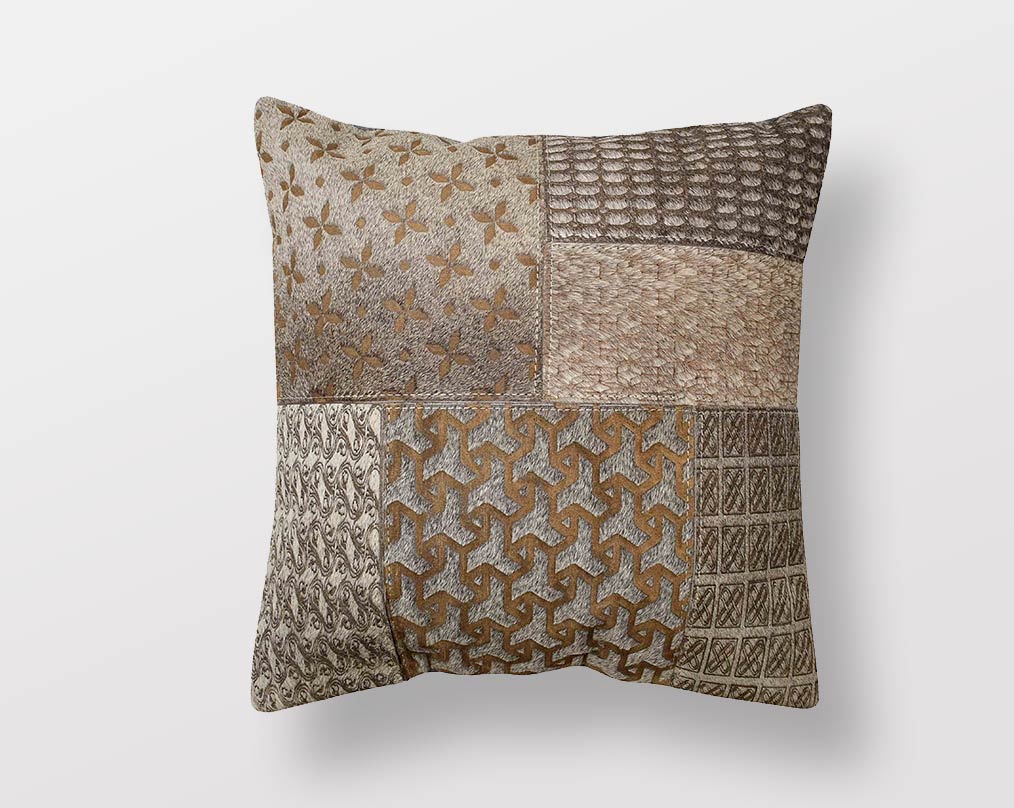 Brown & Grey hair on & leather cushion.