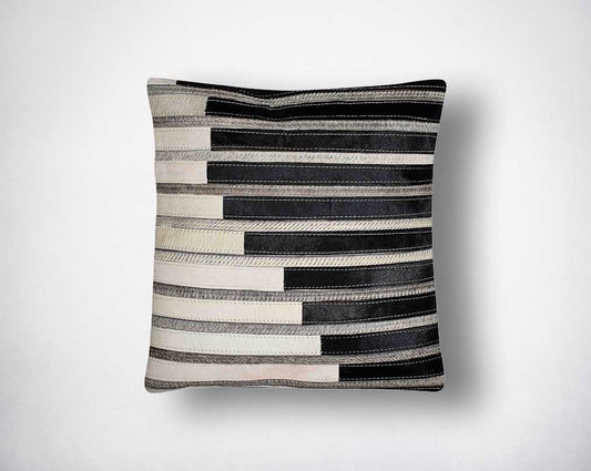 White, black & grey hair on the leather cushion.