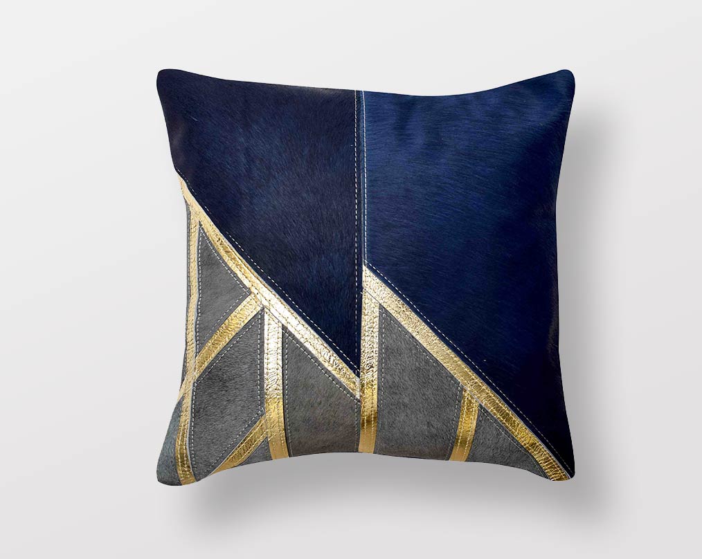 Blue-grey & gold hair on a leather cushion.