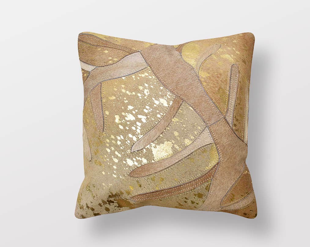 Gold and beige hair on a leather cushion.