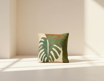 Beige and green hair on a leather cushion.