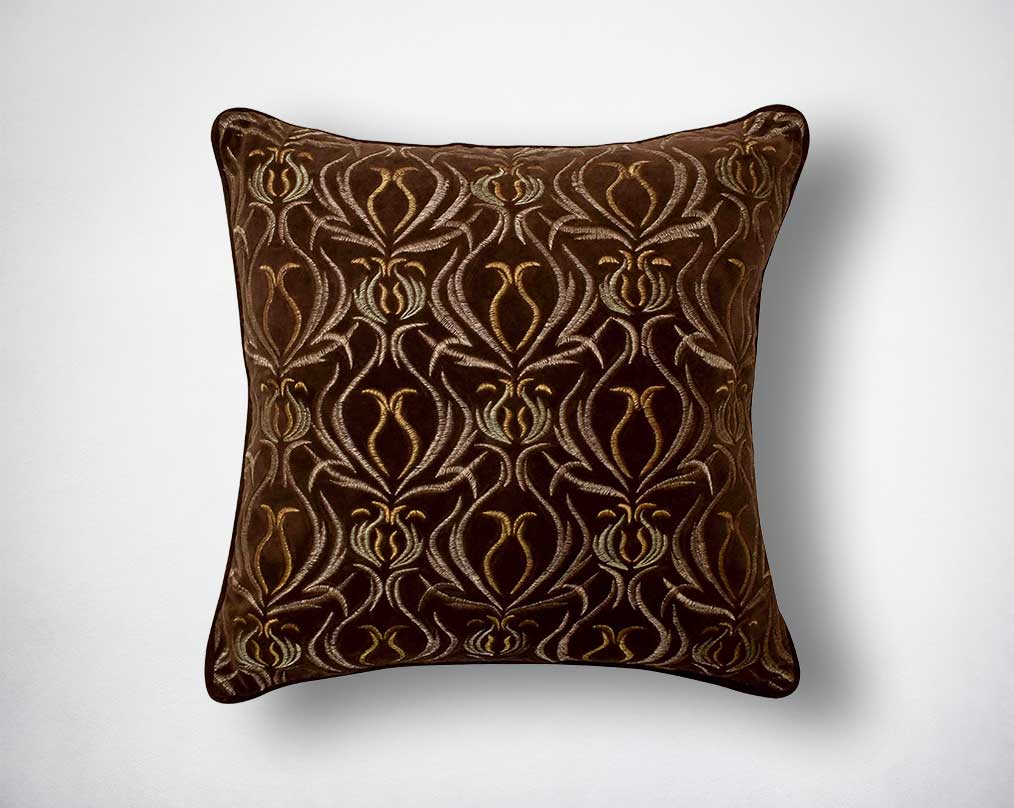 Brown and antique gold poly silk embroidered cushion.