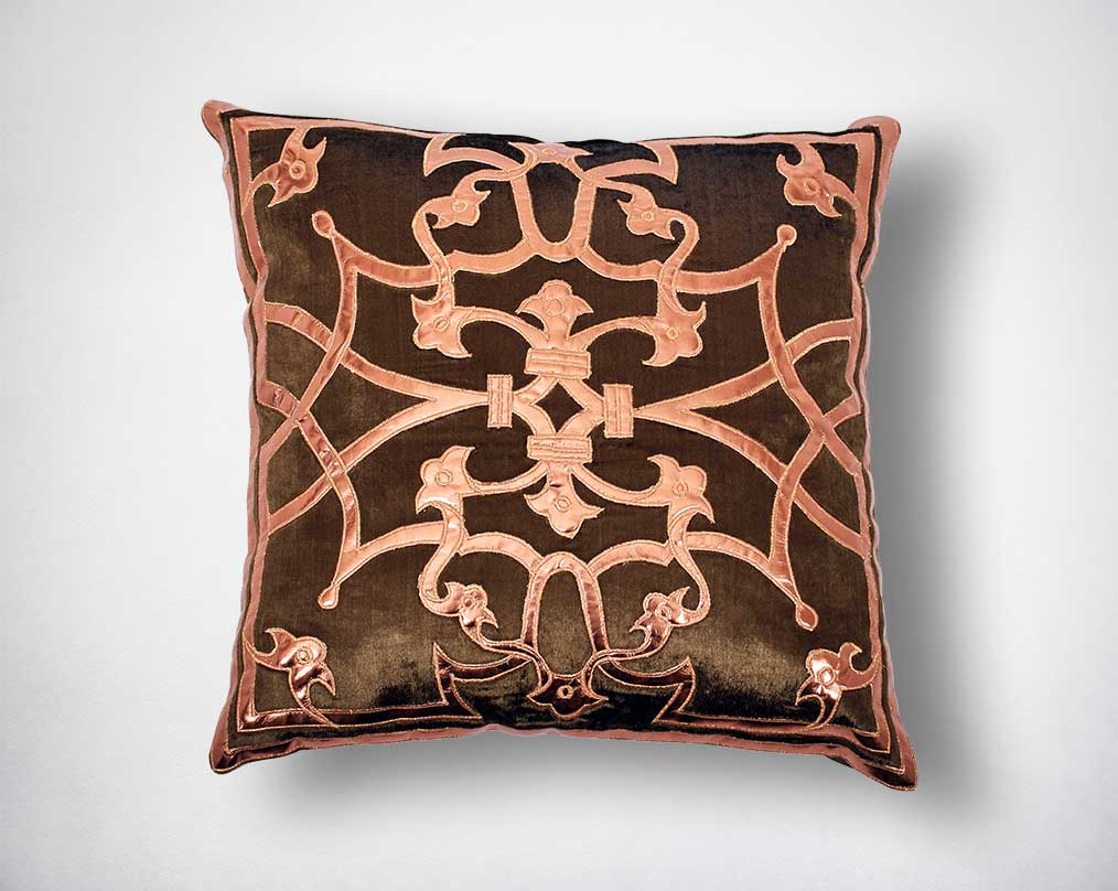 Brown and copper embroidered poly silk cushion.
