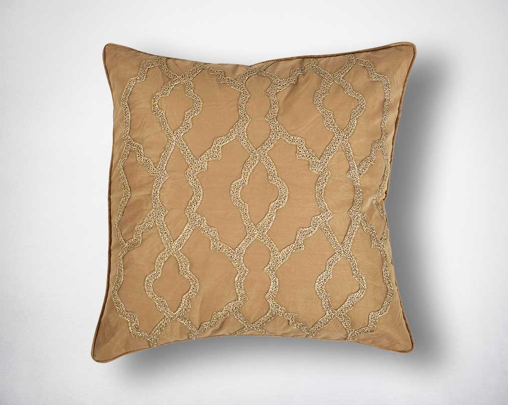 Gold poly silk embroidered cushion.